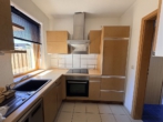 Küche - Wüsting: 2-Zimmer-Erdgeschosswohnung mit Terrasse und Carport