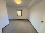 Schlafzimmer - Wüsting: 2-Zimmer-Erdgeschosswohnung mit Terrasse und Carport