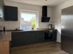 Blick in die Küche - Hude-Nord: Kleines Einfamilienhaus mit Garten und Garage!