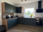 Blick in die Küche - Hude-Nord: Kleines Einfamilienhaus mit Garten und Garage!