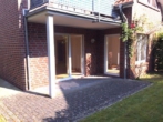 Blick auf Die Terrasse - Hude-Nord: Kleine Erdgeschosswohnung mit Terrasse in äußerst zentraler Lage!