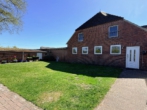 Außenansicht - Wüsting: 3-Zimmer-Obergeschosswohnung in ländlicher Lage mit Terrasse und Garage!