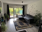 Wohnzimmer - Erdgeschosswohnung mit Terrasse und Garten in Hude-Süd!